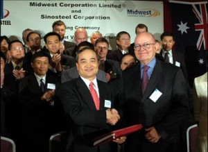 October 2005: Huang Tianwen (FL), president of Chinese state-owned Sinosteel Corporation shakes hands with then president of Australia's Midwest after signing an agreement for joint development of iron ore mines in WA.  Investment in Australia by Chinese state-owned companies brings leaders of these enterprises into close contact with profit-obsessed executives of capitalist, local firms; and is thus an entry point for both corruption and capitalist values into socialistic, state-owned PRC enterprises. 