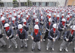 Above: South Korean Ssangyong workers armed with metal pipes during their 2009 industrial struggle with the car company. In South Korea workers have a strong history of resisting their exploiters and subsequently being brutalised by the capitalist state.