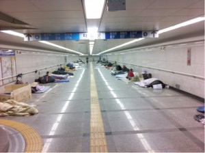 Seoul’s subway at 7pm where 33 or more homeless people are resting. This situation in South Korea is in stark contrast to that in its northern socialistic neighbour where housing has been expropriated from the landlords and collectivised to provide free public housing.