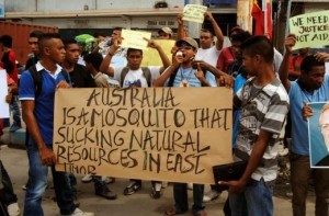 December 2013 protest by East Timorese against Australian capitalists’ theft of Timor’s oil and gas wealth. Protest followed revelations that Australia had spied on East Timorese officials in order to gain the upper hand in negotiations over partitioning East Timor’s seabed natural resources. Protesters chanted, "Australia,imperialist, capitalist!"	and "Australia	is a thief of	world oil". Australian imperialist jack booting around the South Pacific region is underpinned by U.S. power. Hence, Australian capitalist rulers’ loyalty to U.S. imperialism and Australian ruling class support for U.S. marauding in the Middle East. 