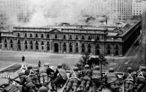  Chile, 1973: Soldiers attack the presidential residence where President Salvador Allende was residing. A socialist, Allende, popularly elected in 1970, tried to institute pro-working class measures and promised a “peaceful”, “constitutional” road to socialism. The Chilean capitalist state that he administered had other ideas. They overthrew him in the violent 1973 coup. The resulting military dictatorship, led by coup leader General Augusto Pinochet, was responsible for murdering and torturing tens of thousands of leftists.