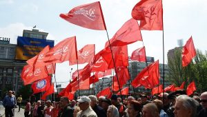 Communist Party of Ukraine (KPU) flags at a May Day 2014 rally in Ukraine. This party has faced vicious state repression and violent fascist attacks since the February 2014 right wing coup. The international workers movement must stand in solidarity with the KPU against right wing attacks.