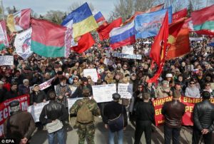 Donetsk, April 2014: Protesters fly the flag of Belarus alongside Russian and Ukrainian flags at this anti-governmentally. Alongside ethnic Russians, many people in the Donbass – including ethnic Ukrainians, Bulgarians and Byelorussians – use Russian as their main language. Thus, the Donbass rebel movement, based on Russian speakers, incorporates more than simply ethnic Russians alone.