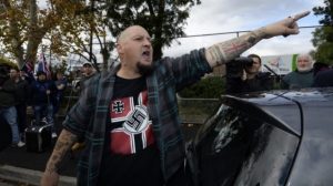 Melbourne, May 2015: An activist with the fascist United Patriots Front (UPF) proudly brandishes Nazi symbols at their rally against communism and Islam. The UPF and Reclaim Australia are avowedly anti-Islam and anticommunist. In truth they are not only bigots opposed to Muslims but are extreme white supremacists intent on stirring up racist violence against all coloured people – they are against Aboriginal people and against people from Asian, African, Middle Eastern and Pacific Islander backgrounds.