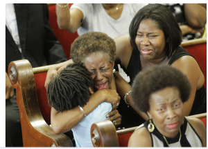 Charleston, South Carolina, United States: Friends and relatives of victims at a ceremony to mourn the murder of nine attendees at the Emanuel African Methodist Episcopal Church.