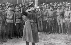 From the time that they overturned capitalist rule in the 1917 Russian Revolution, the Soviet working class had to mobilise the forces of armed power to defend their liberation. In this picture, founder of the Soviet Red Army, Leon Trotsky, motivates troops in 1918 during the bloody Civil War against insurgent armies attempting to restore capitalist power.