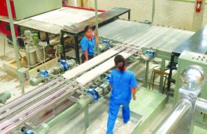 Workers at North Korea’s Taedongang Tile Plant. North Korea has a relaxed and friendly work environment where at least two people are stationed at assembly line node points that would, in places like Australia or Indonesia, have only one worker doing all the work. Photo: Trotskyist Platform