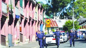 Police stampeding around Redfern’s The Block. The Aboriginal community on The Block faced decades of violent police raids and racist bullying.