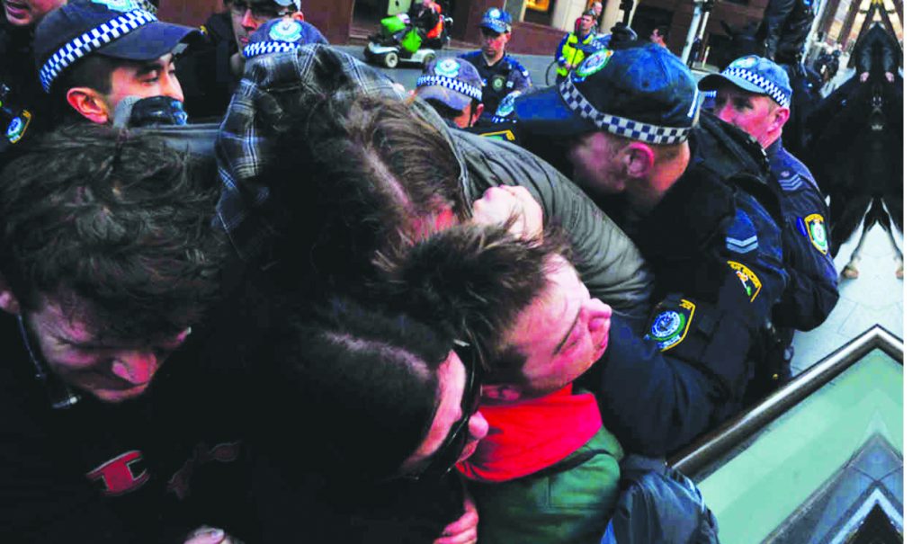 Sydney, 19 July 2015: Police brutalise anti-racism activists counter-demonstrating against a rally by the extreme racist “Reclaim Australia” movement. Since police serve the same capitalist ruling class whom the fascists and their race-hate ideology truly serve, they are heavily biased towards supporting the fascists in any standoff with anti-fascists.