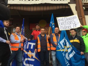 ETU (Electrical Trade Union) on the side of the need for more public housing for the working class. With a placard in the background that reads "Social Cleansing Evictions, Millers Pt".