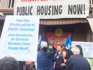 TP Placard that reads " Stop the privatisation of public housing! Stop the attacks on services working class people need".